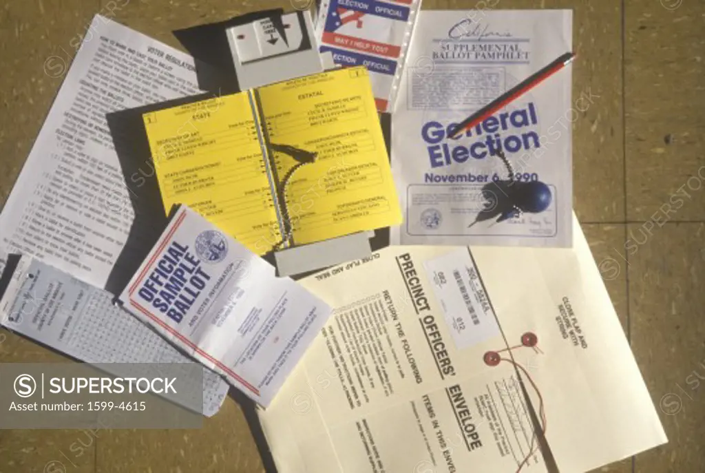 Close-up of a voting booth with ballots, ballot machine and election pamphlets, CA