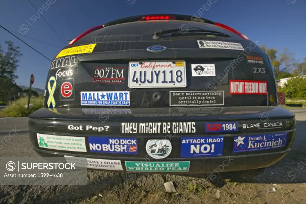 Car with political and social issues bumper stickers in Oak View, California