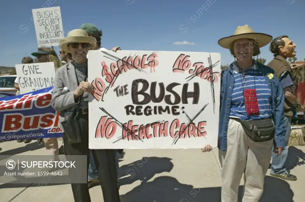 Protestor in Tucson Arizona of President George W. Bush holding a sign protesting his Health Care plans 