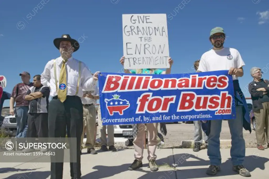 Protestor in Tucson Arizona of President George W. Bush holding a sign proclaiming Billionaires for Bush