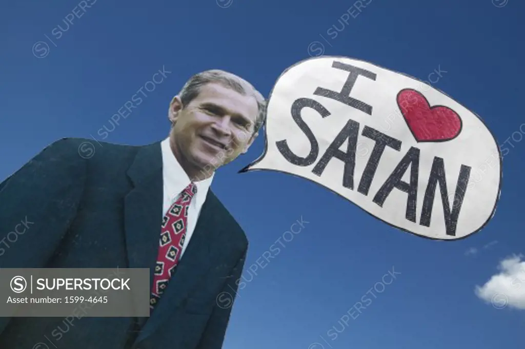 Picture of anti-Bush political rally in Tucson, AZ with a sign saying President George W. Bush Loves Satan in Tucson, AZ