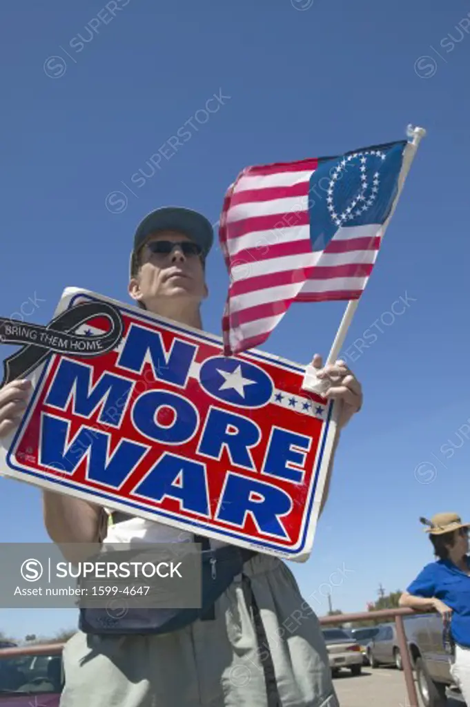 Picture of anti-Bush political rally in Tucson, AZ with sign reading No More War