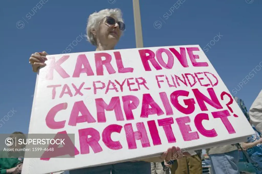 Picture of anti-Bush political rally in Tucson, AZ with signs about Karl Rove in Tucson, AZ