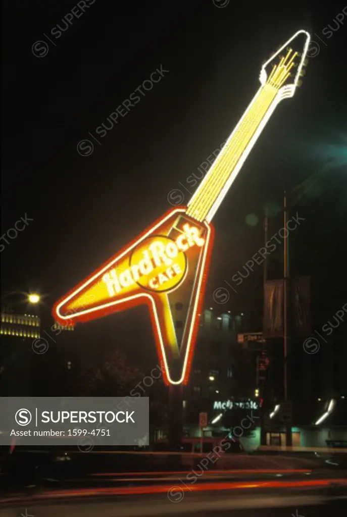A neon sign that reads Hard Rock Cafe”