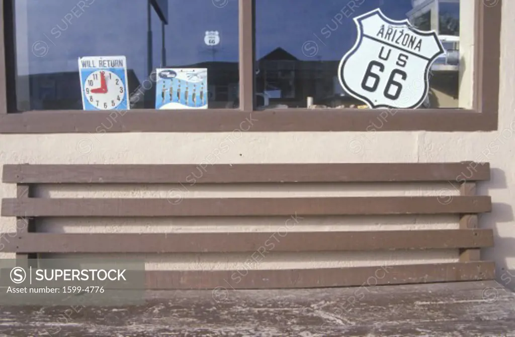 A store window with a Route 66 sign 