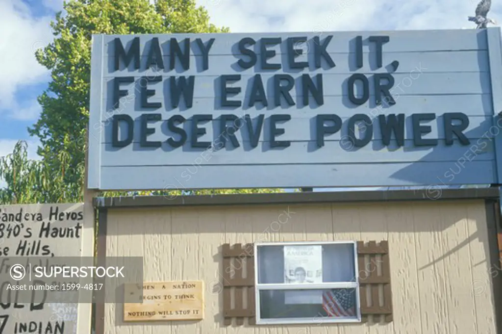 A sign that reads Many seek it, few earn or deserve power