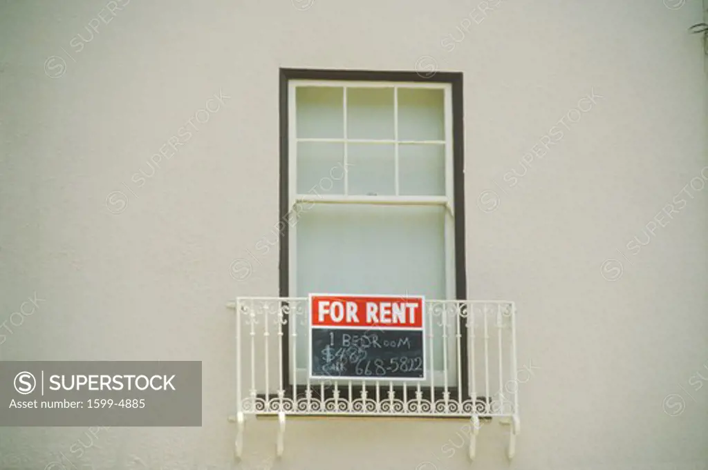 A sign that reads For Rent”