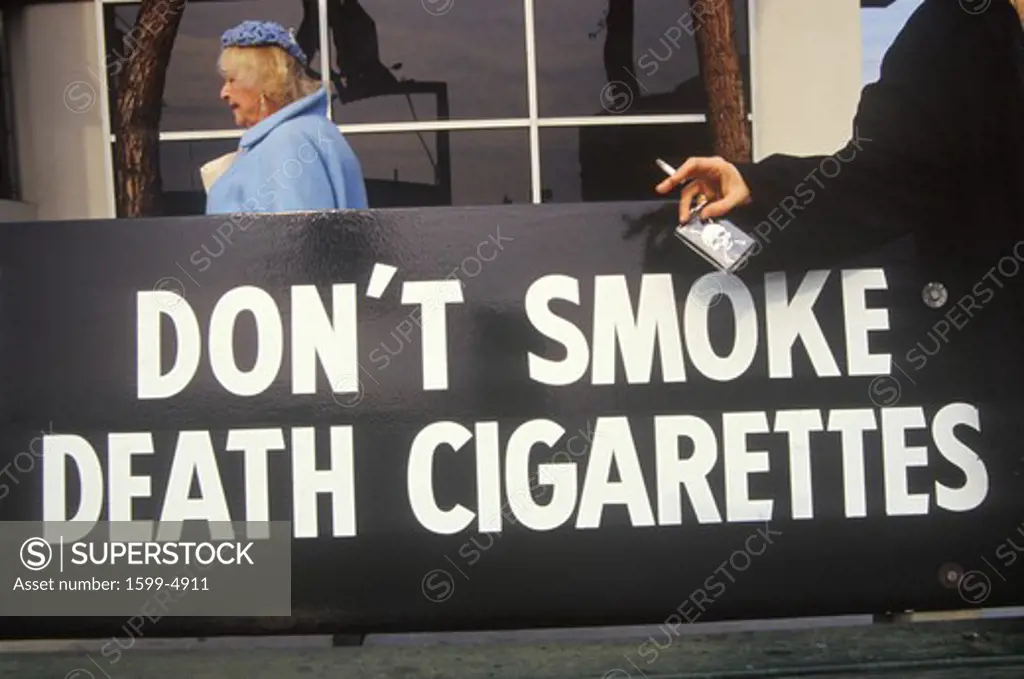 A sign that reads Don't smoke death cigarettes”