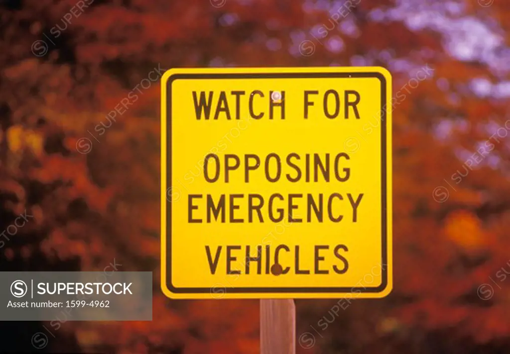 A sign that reads Watch for opposing emergency vehicles”