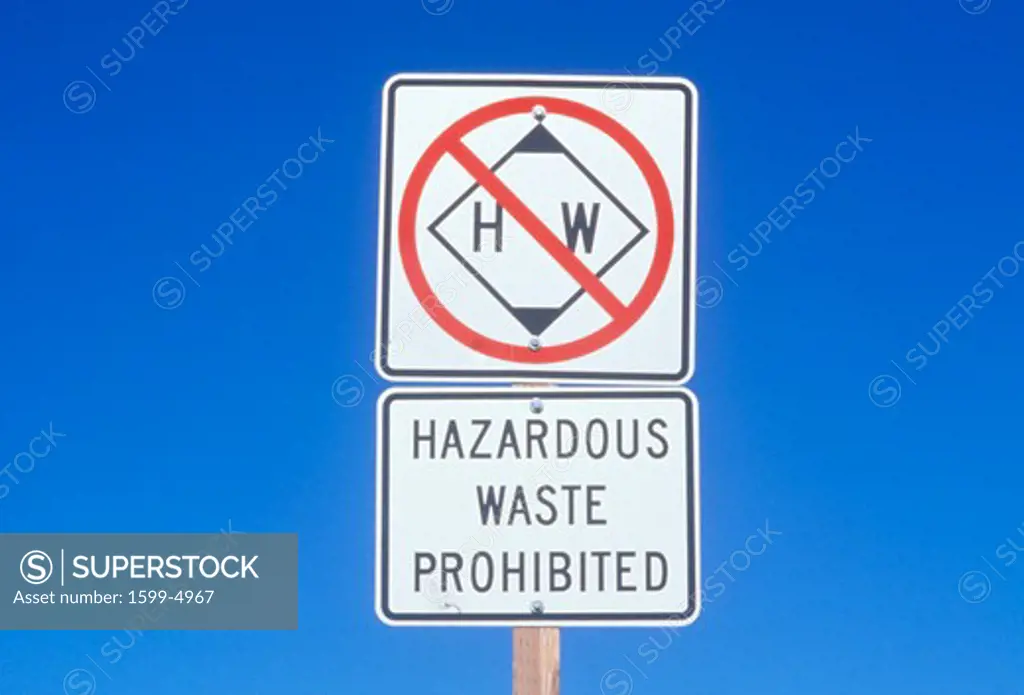 A sign that reads Hazardous waste prohibited”