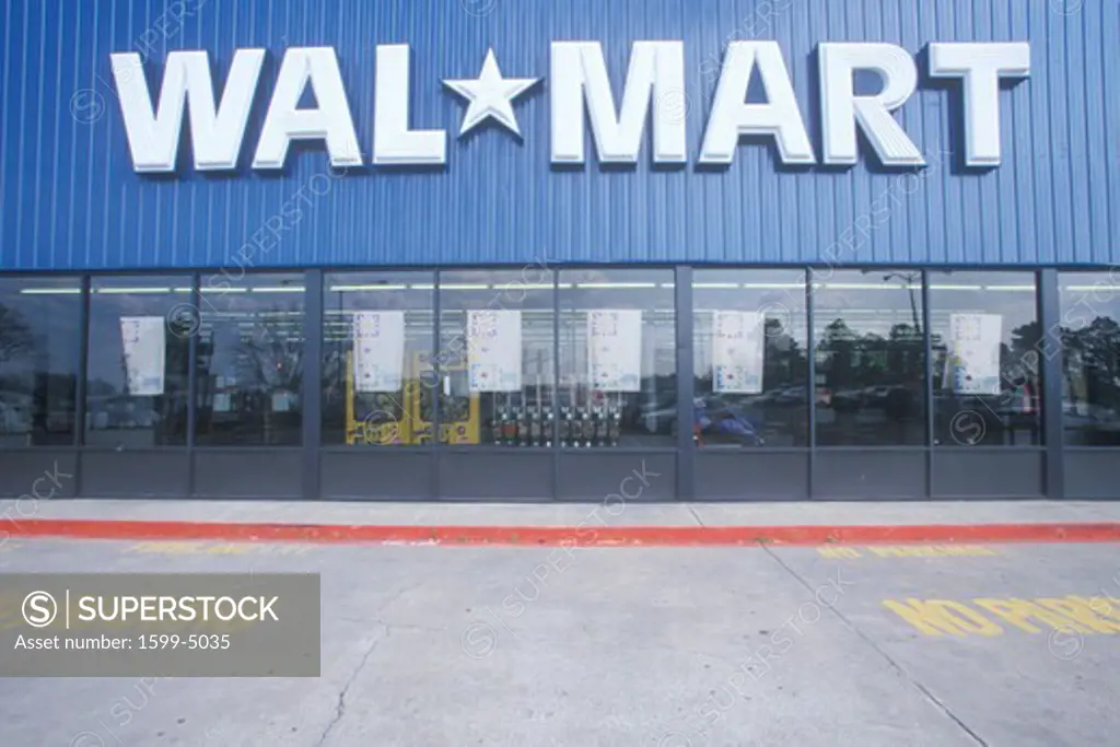 Wal * Mart Supercenter Store  front entrance and parking lot in Southeast USA