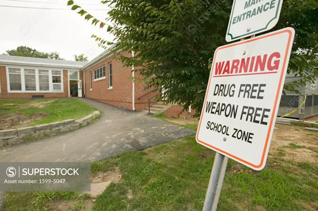 A grade school displays sign stating it's a 'Drug Free and Weapon Free' school zone, Clark School, Webster Groves, Missouri 