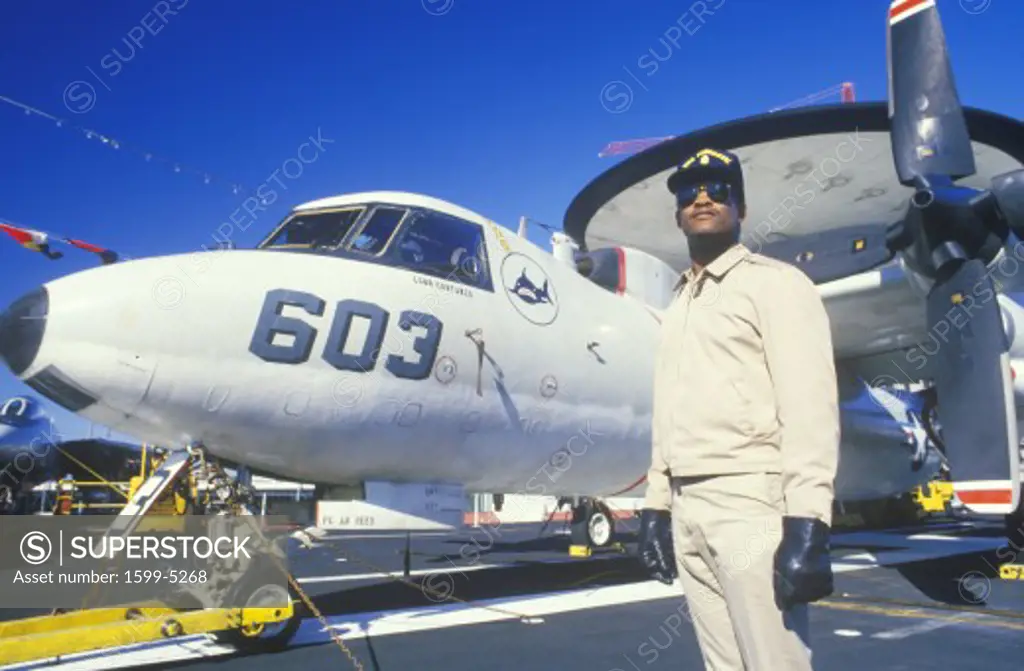 Afro-American Soldier Standing By Aircraft, USS Forrestal, New Orleans, Louisiana