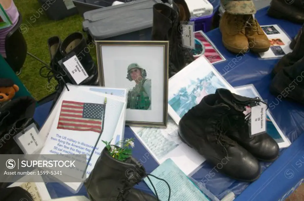 US Soldier killed as symbolized by 1746 Military boots showing US Military Personnel killed in Iraq at the Eyes Wide Open” exhibit at Independence Hall, Philadelphia, Pennsylvania on July 4, 2005