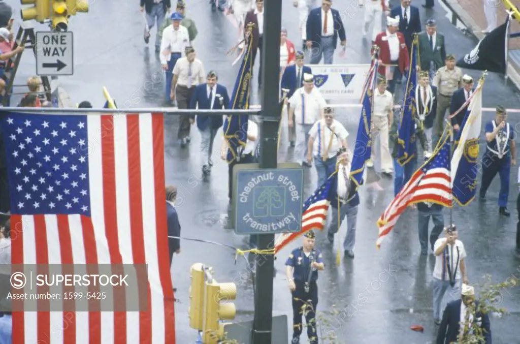 American Flag and Veterans Marching in Parade, United States of America