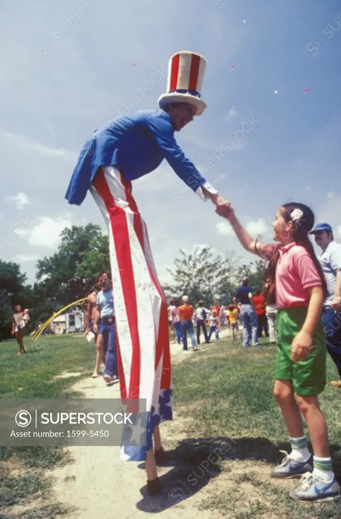 Man on Stilts Dressed As Uncle Sam Shaking Girl's Hand, Salina, Kansas