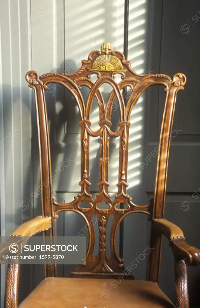 Early American hand carved chair with sun design