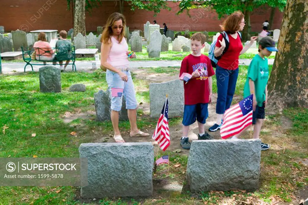 Two children look at Revolutionary Graves in Christ Church Burial Ground in Philadelphia, Pennsylvania