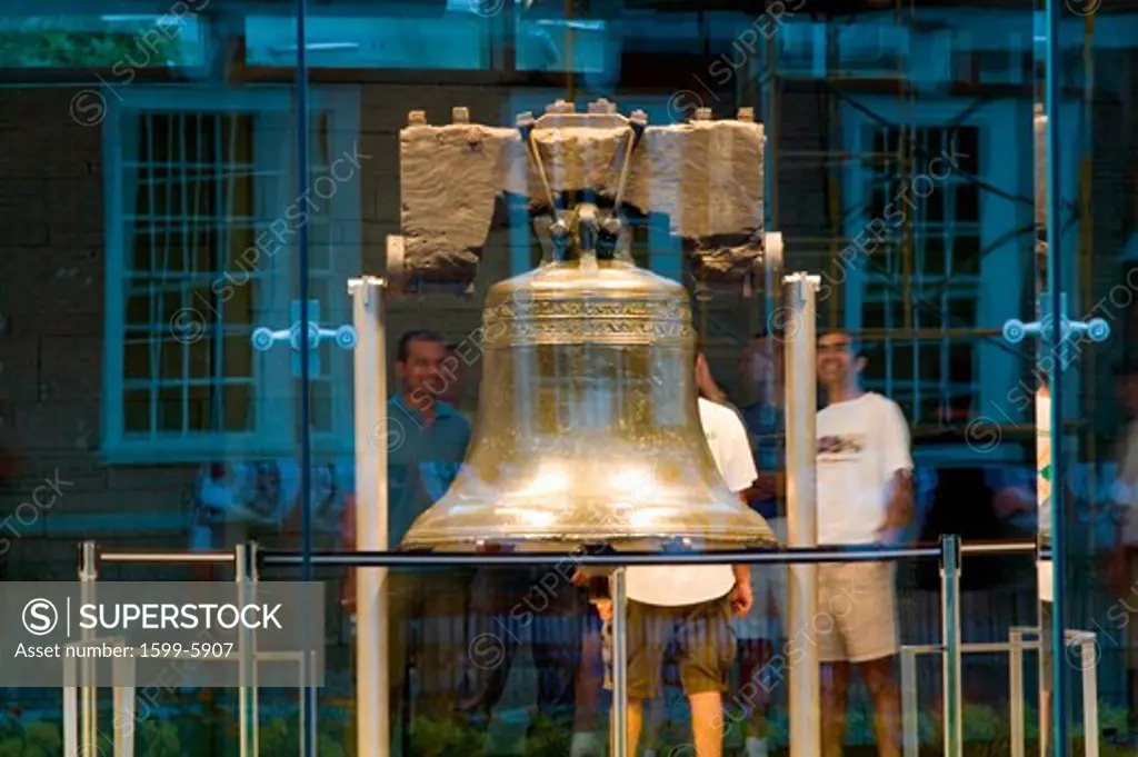 Night shot of Liberty Bell, at Liberty Bell Center, with reflection of Independence Hall in Historic District of Philadelphia, PA