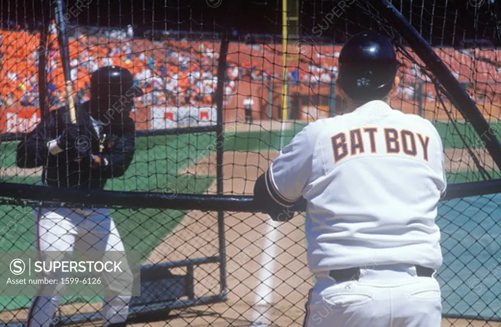 Rear view of Bat Boy observing pitcher at Baseball game, Candlestick Park, San Francisco, CA