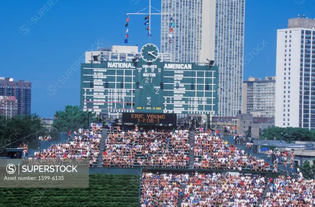 Long view of scoreboard and full bleachers during a professional baseball game, Wrigley Field, Illinois