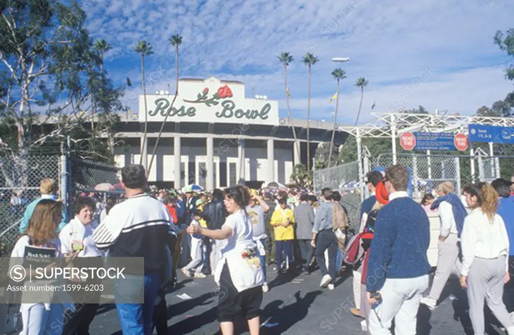 Fans milling around front entrance of Rose Bowl Football Game, Pasadena, CA