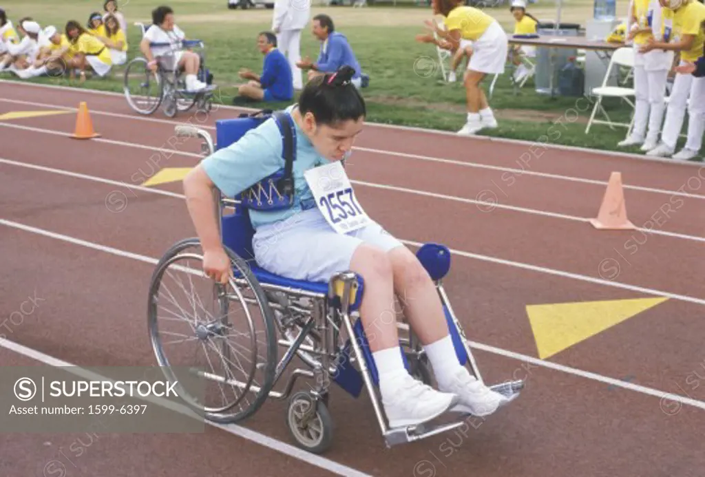 Special Olympics athlete in wheelchair, competing, UCLA, CA