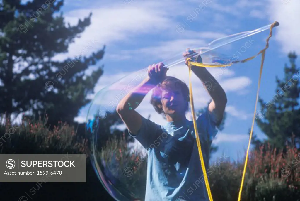 Blowing bubbles, Escalon center, Big Sur, CA