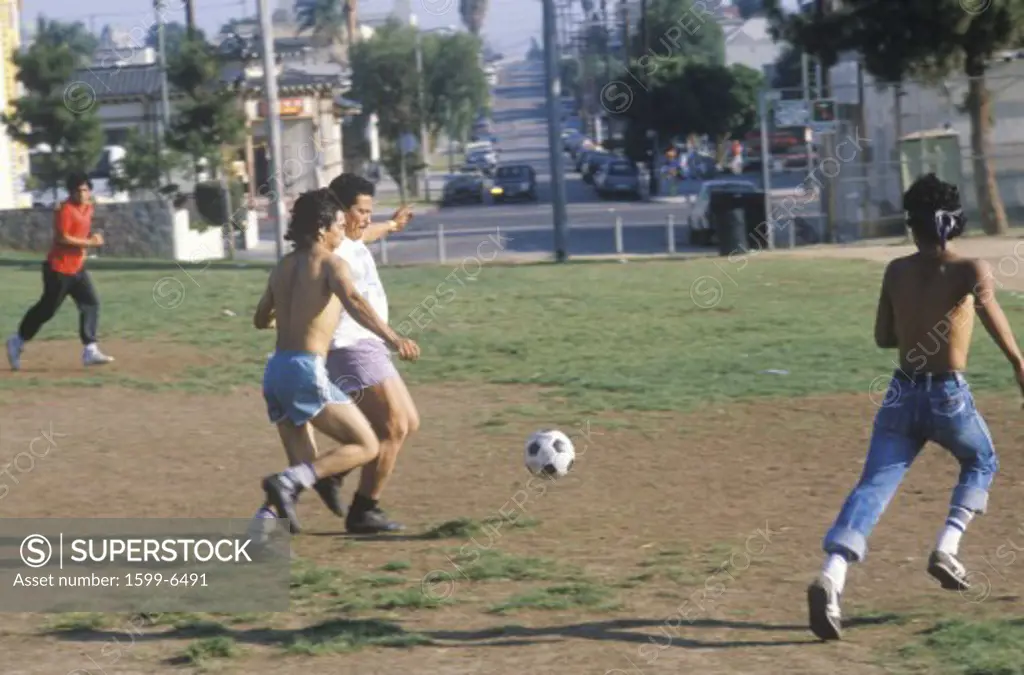 Group of Mexican-American young men playing soccer, Los Angeles, CA