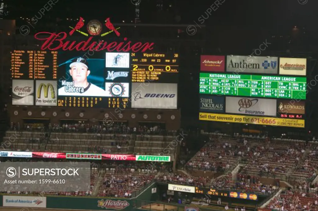In a night game and a light rain mist, a scoreboard is seen at the 3rd Busch Stadium, St. Louis, Missouri on August 29, 2006
