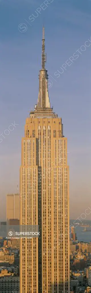 This is a close up of the Empire State Building at sunset. It is the view from 42nd Street and 5th Avenue.