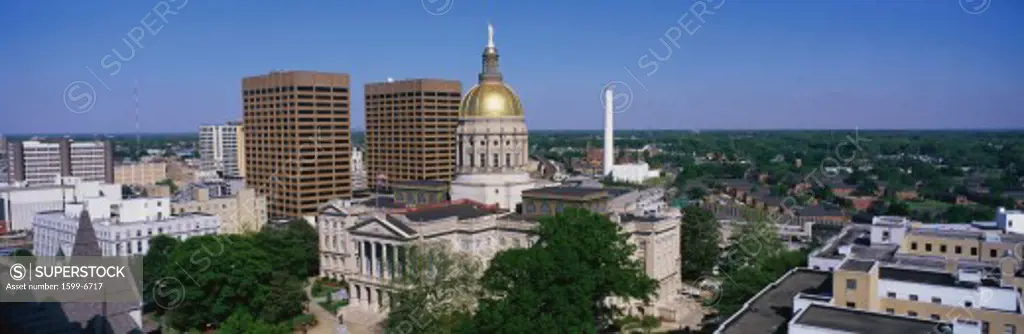 This is the State Capitol and skyline in daylight.
