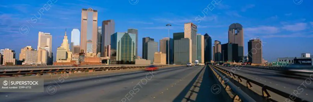 This is the freeway to the center of the city with the skyline in the background. The Chase Tower is the building in the center. 