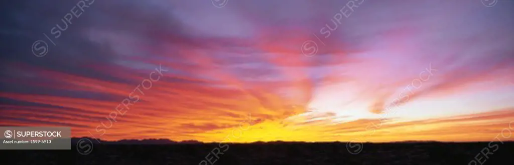This is a sunrise over the Sonoran Desert at the Pinacate Biosphere Reserve. It is located at the borderlands of northwestern Mexico near Arizona. They are cirrus clouds.