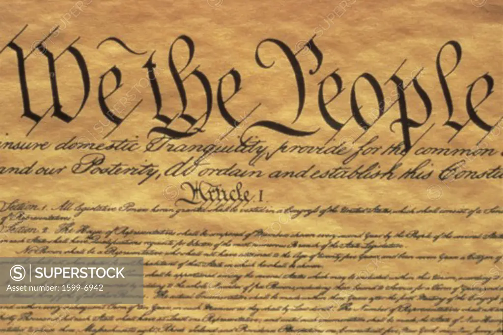 This is the Preamble to the U.S. Constitution. It starts with the phrase We The People and shows only some of the writing from the upper left hand corner of the document of the Constitution. It is written on parchment paper that is now faded, showing its age.