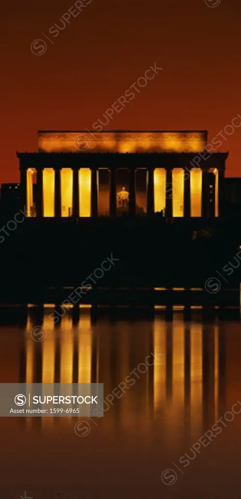 This is sunset at the Lincoln Memorial. An orange glow and reflection are shown in the reflecting pool in front of it.