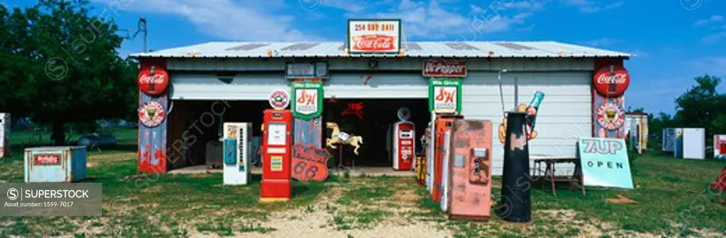 This is an old gas station with the original pumps and vintage signs. It is a piece of roadside America.