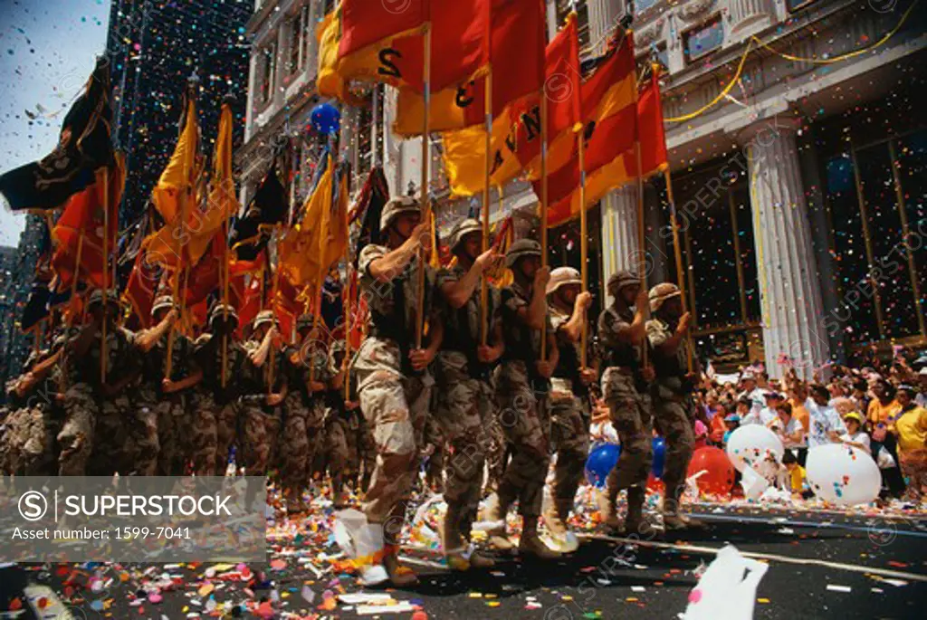 This is a Ticker Tape Parade showing the Desert Storm Victory Parade. It took place in the Canyon of Heroes where about 4.7 million people attended.  This shows army soldiers marching in line.