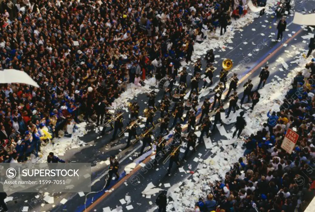 This is a marching band in a Ticker Tape Parade on Broadway and Wall Street. It took place in the Canyon of Heroes. There were about 2.2 million people who attended. It celebrated the Mets as the World Champions.