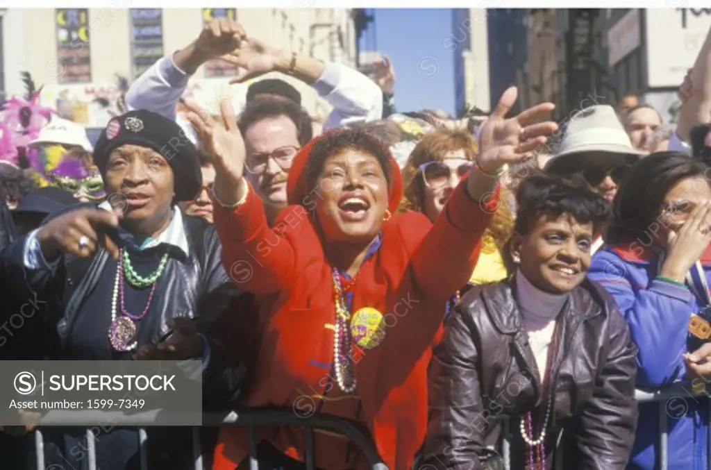 Joyous Spectators at Mardi Gras Parade and African American woman, New Orleans, Louisiana