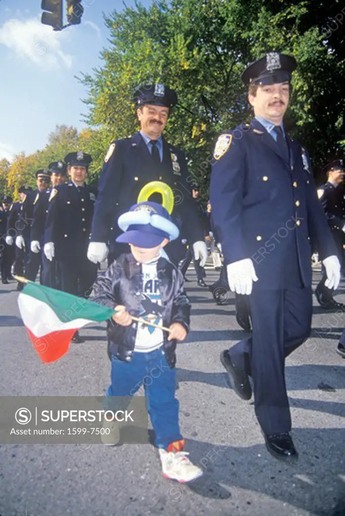New York City Police Officer with child at Columbus Day Parade, New York City, New York