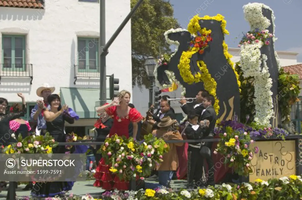 Woman performing Flamenco dancing on parade float during opening day parade down State Street, Santa Barbara, CA, Old Spanish Days Fiesta, August 3-7, 2005