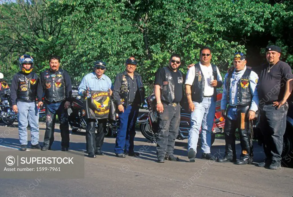 A group of men with their Harley Davidsons from the Latin American Motorcycle Association take a break in Dallas, Texas during their trek from Chicago to Guadalajara