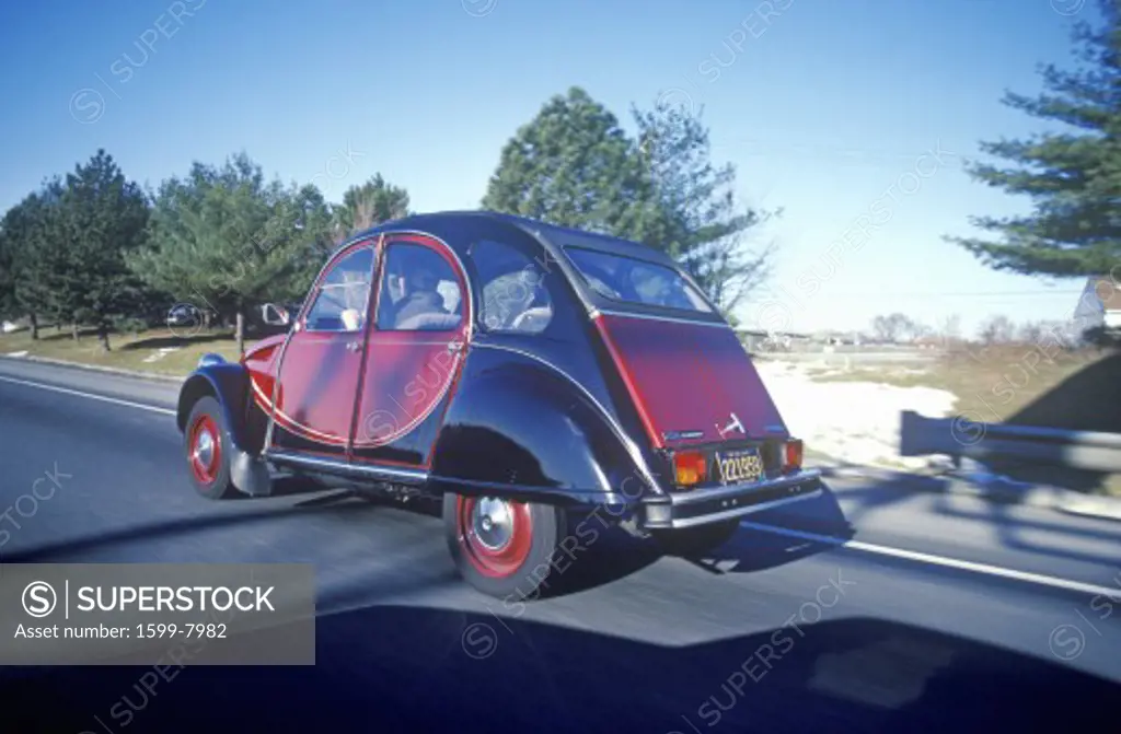 An old model Citroen on the road