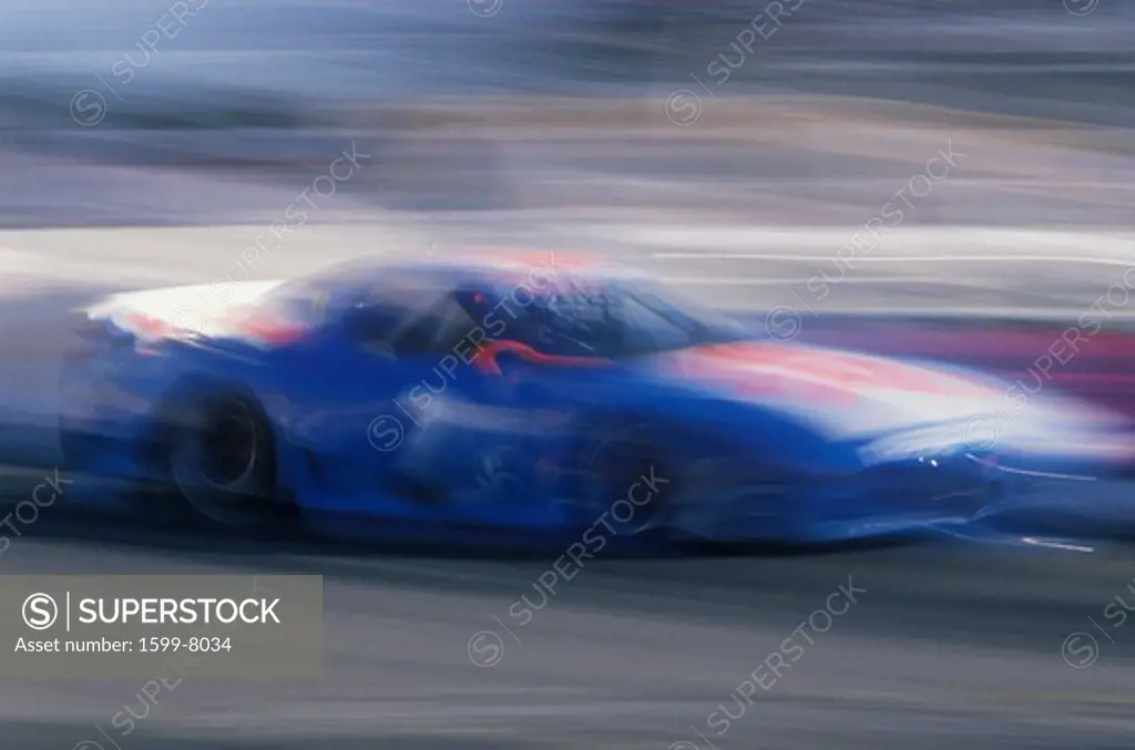 A blue Mazda in the Toyota Grand Prix Race at the Indy Car World Series in Long Beach, CA
