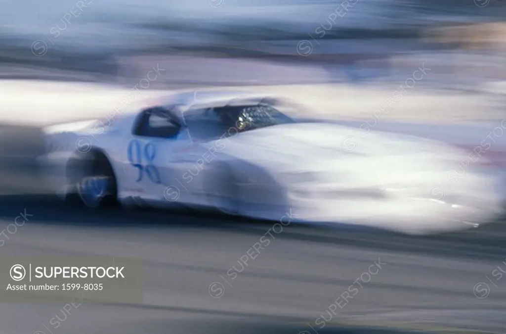 A white car in the Toyota Grand Prix Race at the Indy Car World Series in Long Beach, CA