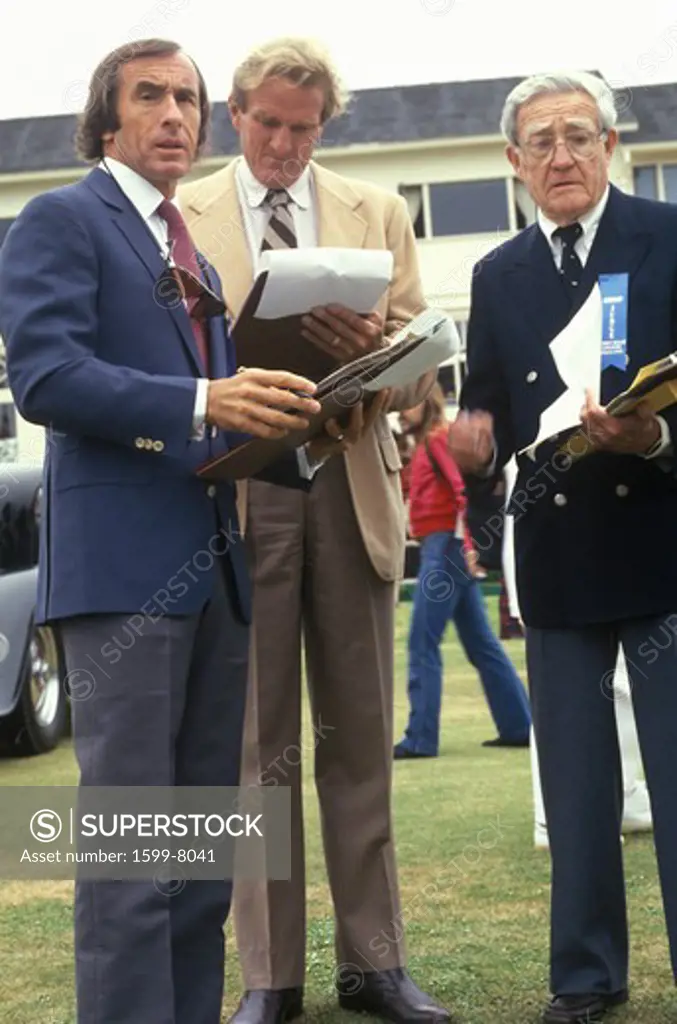 The Scottish race car driver Jackie Stewart and other former racecar drivers judge classic cars at the 35th Annual Concours D' Elegance Competition, ca. 1985