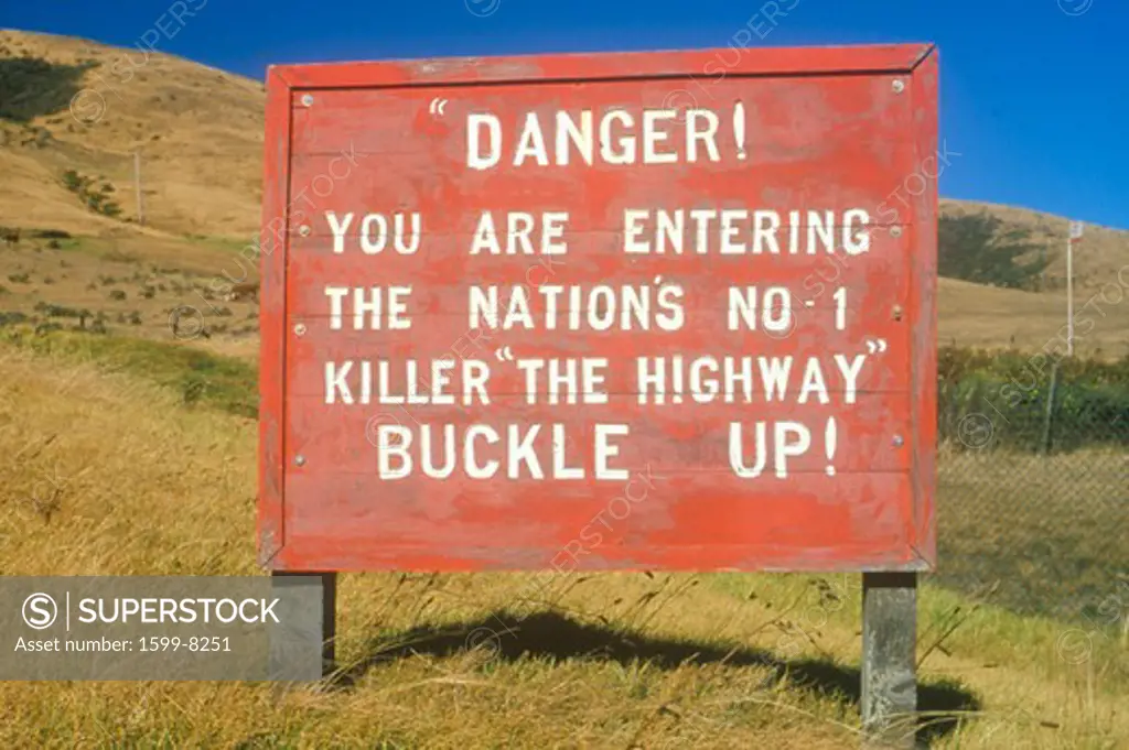 Danger road sign warning to buckle up!