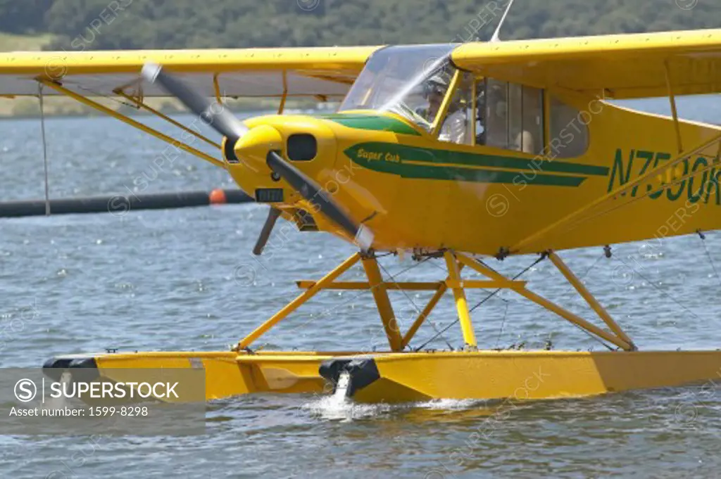 Yellow amphibious seaplane on Lake Casitas, Ojai, California