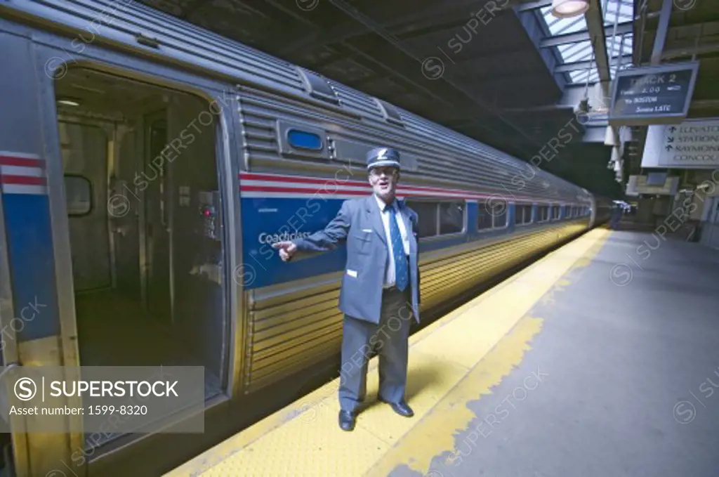 Conductor at Amtrak train platform announces 'All Aboard' at East Coast train station on the way to New York City, New York, Manhattan, New York
